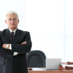 Portrait of successful mature businessman in office